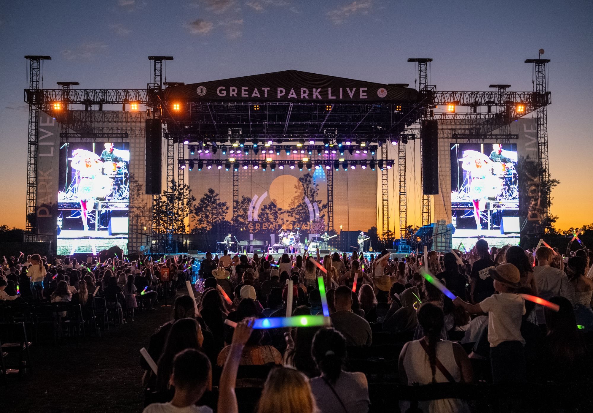 Great Park Live at sunset, crowd waving light sticks
