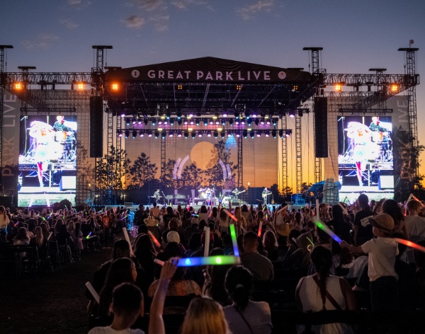 Swift Nation at Great Park Live with a crowd holding light sticks