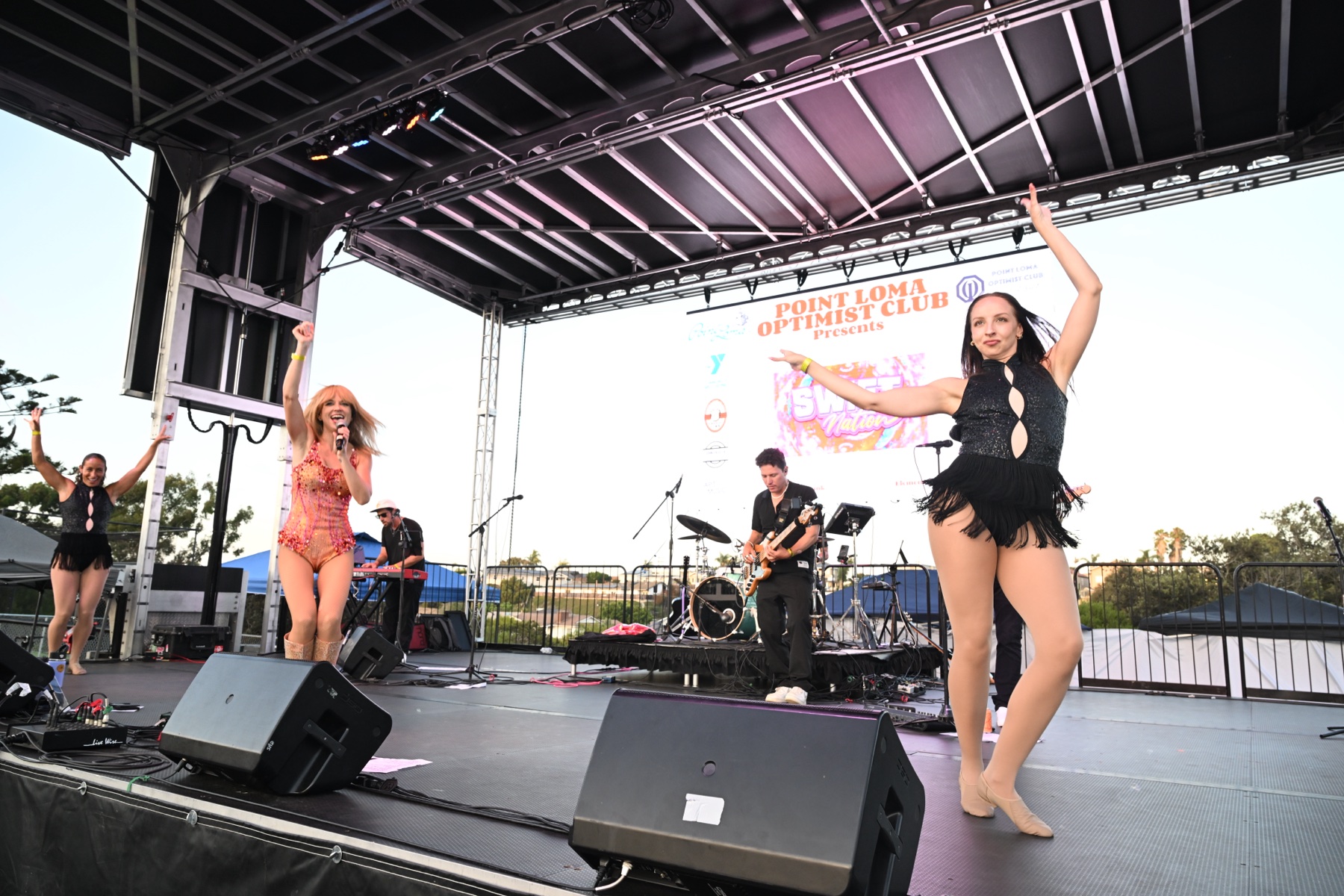Melody Ebner, the band and two dancers at Point Loma