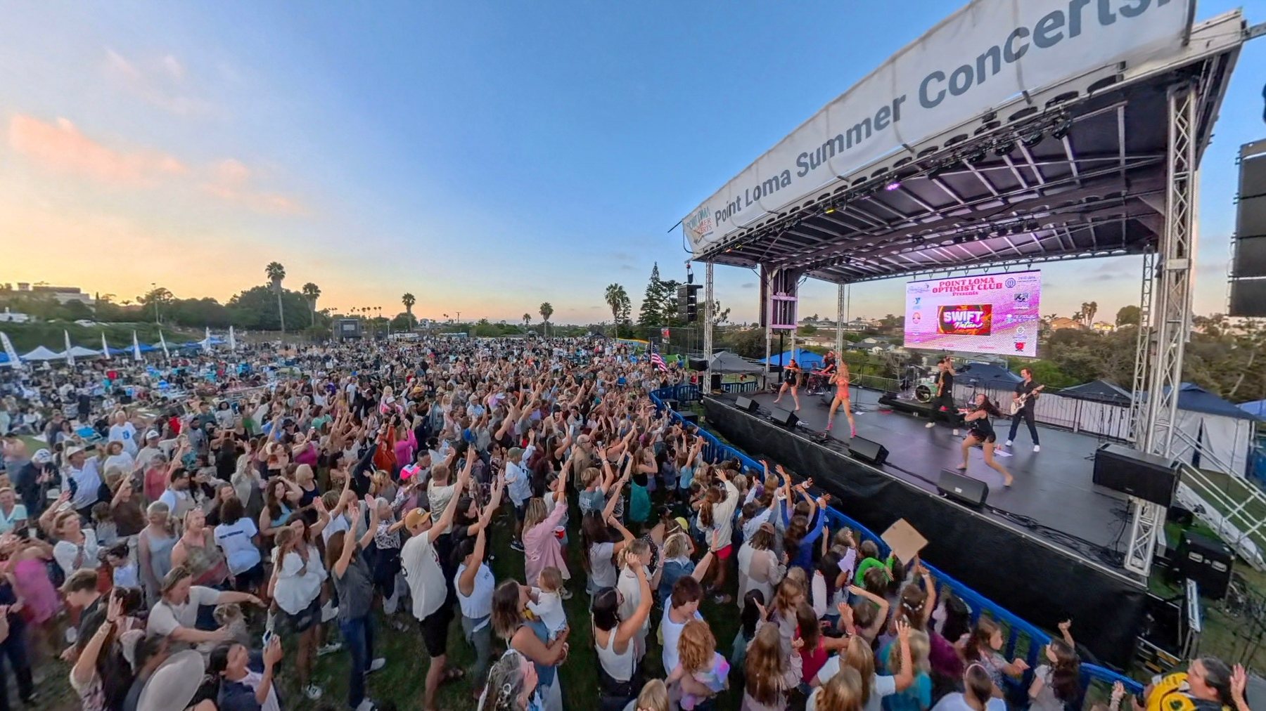 Huge crowd with hands up at Point Loma Summer Concerts